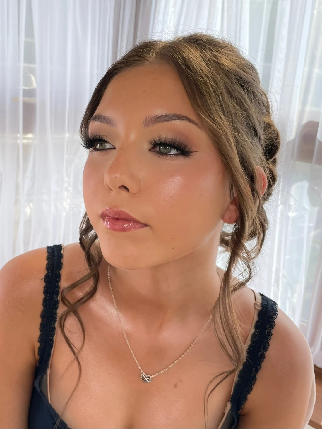 Blended occasion makeup with lashes on a client wearing her hair up