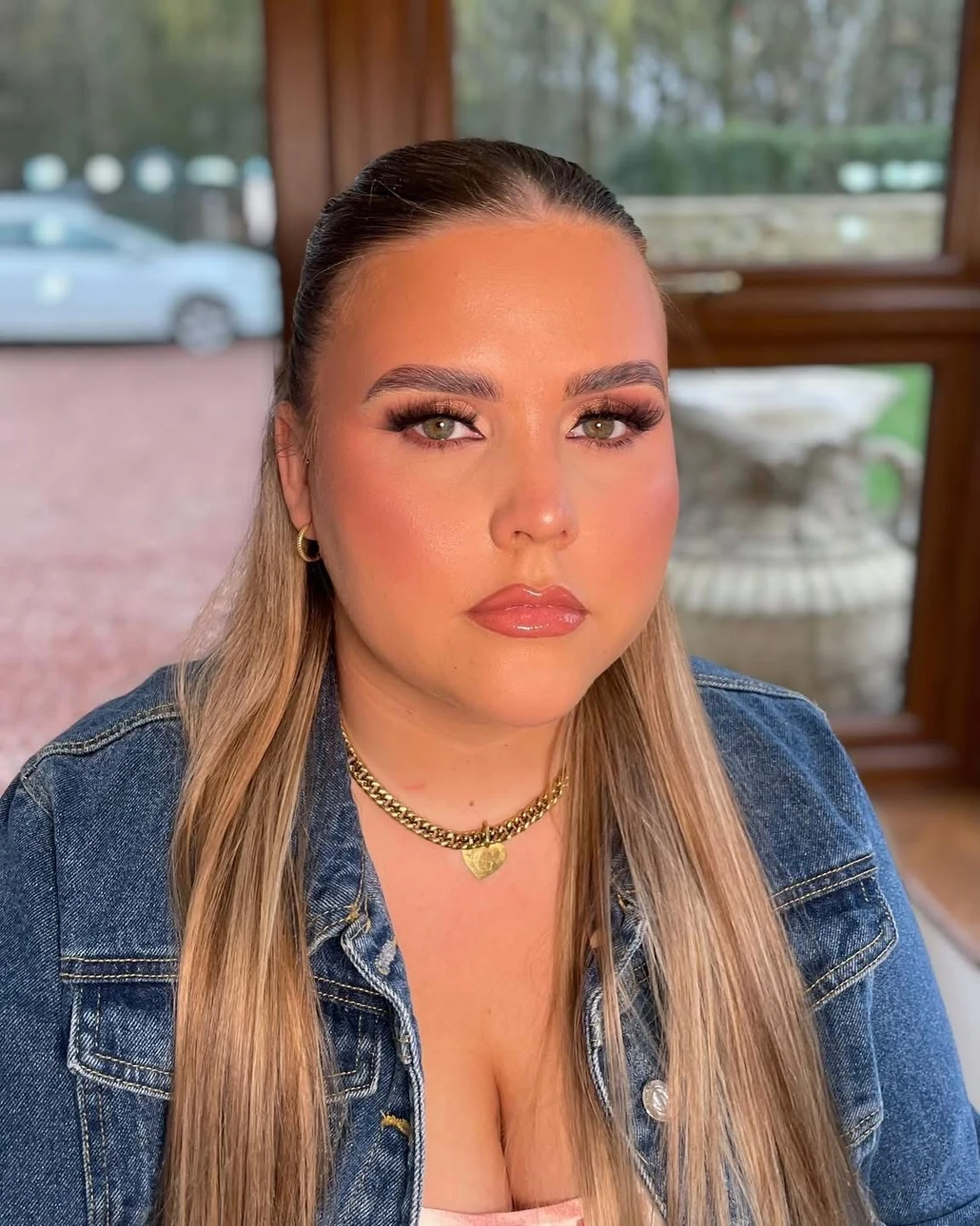 Rosy eye makeup and blush on a client