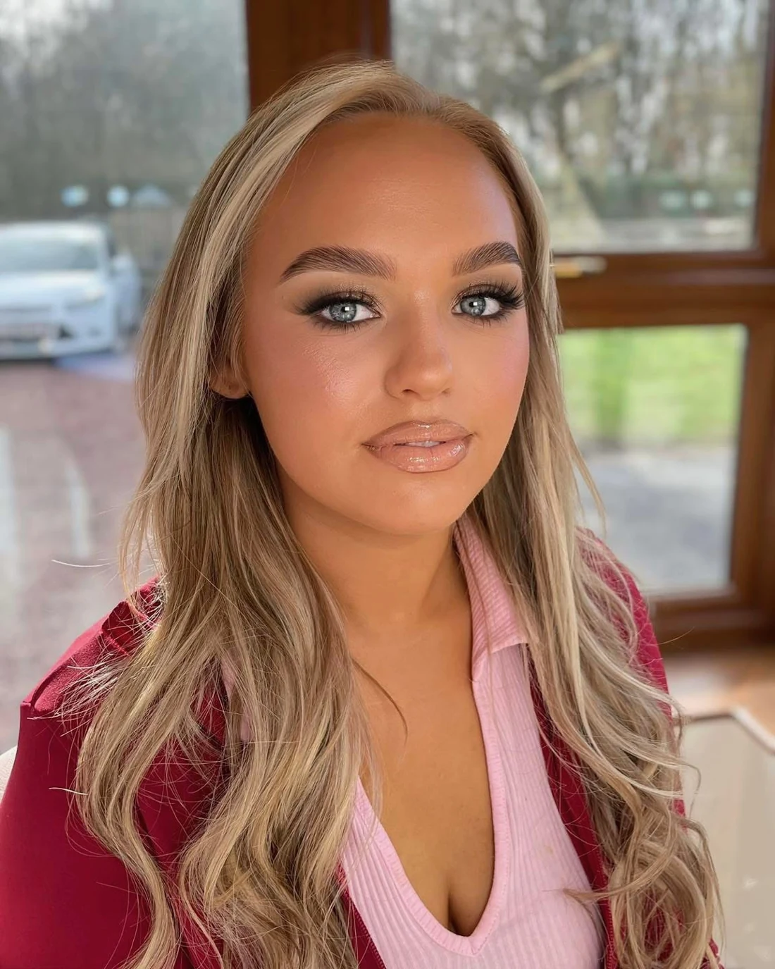 Defined eyes, warm blush and nude lips on a blonde client